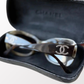 Close-up of silver CC logo on temple of Chanel vintage sunglasses