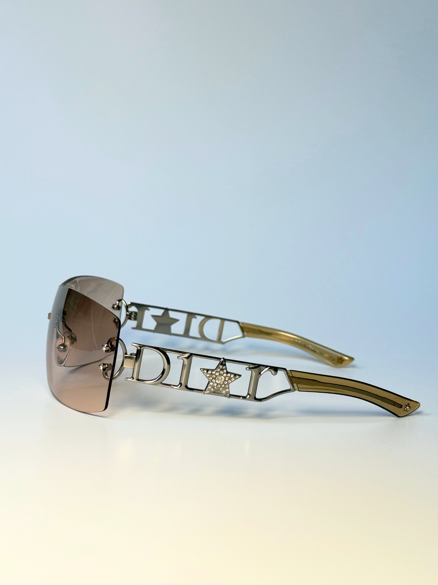 Side view of vintage Christian Dior Diorlywood sunglasses with star-accented frame