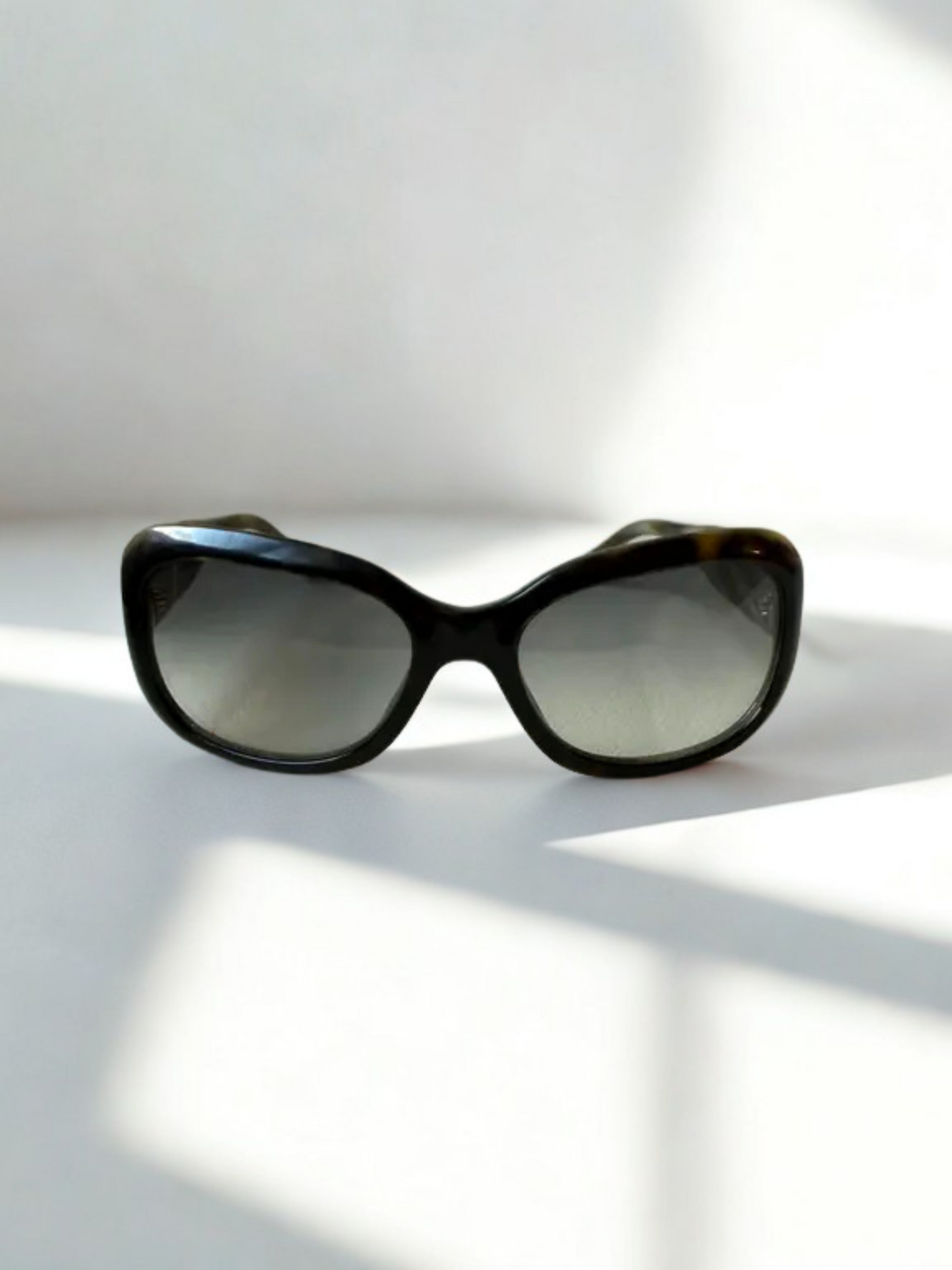 Front view of Chanel sunglasses with ombré gradient lenses