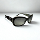 Side view of Chanel 5102 C.653/11 sunglasses showcasing black, grey, and beige patterned frame